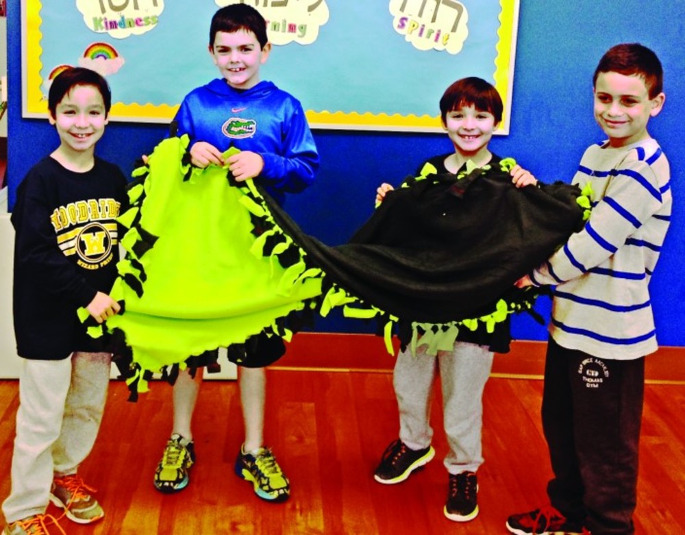 3/4th Graders proudly show off their blanket /Torat Yisrael